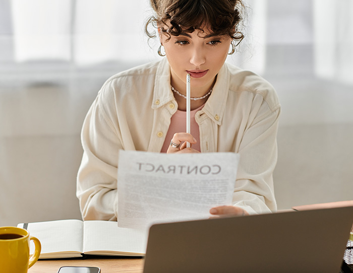 Person reviewing a contract - Contract Review Services