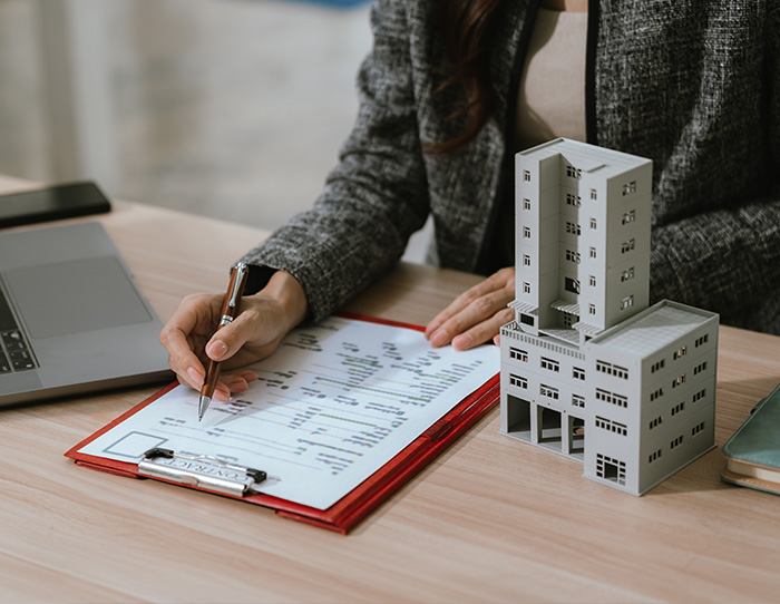 Signing a document - Insurance Valuation Services